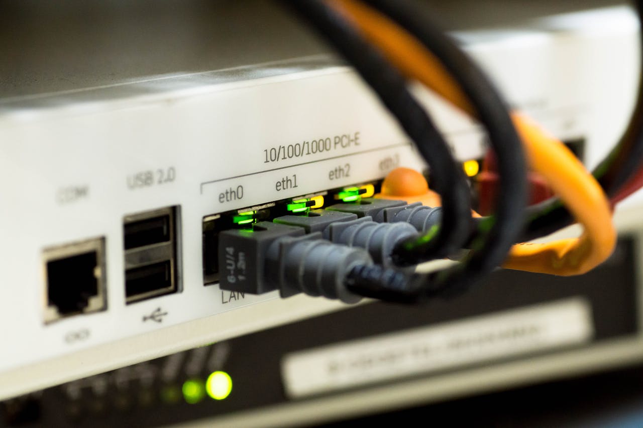 Mastering the First Impression: Your intriguing post title goes here Detailed close-up of ethernet cables and network connections on a router, showcasing modern technology.
